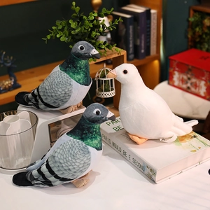Realistic white and grey pigeon plush toy set displayed in a cozy home setting