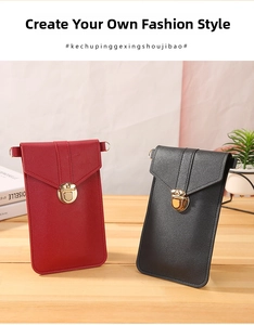 Detail of red and black lychee grain leather mini phone bags with gold buckles