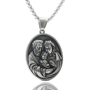 Macro detail of silver stainless steel oval pendant with Holy Family relief and box chain