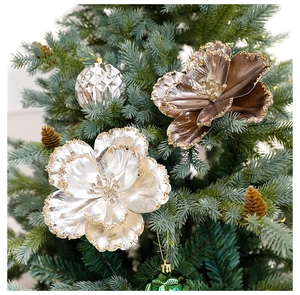 Close-up of champagne silver Christmas tree flowers with glitter edges and pine cones