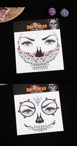 Macro view of Day of the Dead face jewels in red and blue for Halloween costume