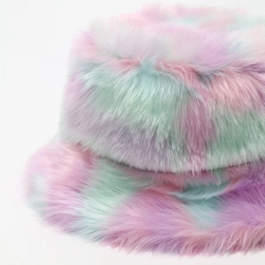 Close-up detail of soft tie-dye plush faux fur texture on a thick winter bucket hat