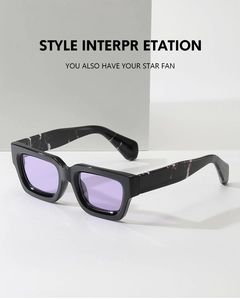 Detail view of square black sunglasses with marble temples and purple translucent lenses