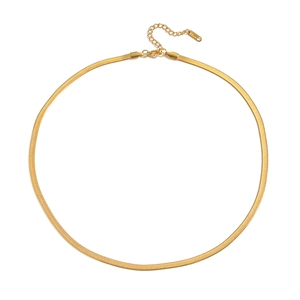 Detailed view of golden snake chain necklace with lobster clasp and extension chain
