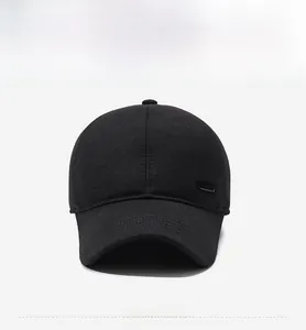 Detailed front view of black winter baseball cap with plush lining and metal logo tag