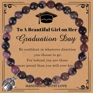 Handmade agate bead bracelet with ladybug charm on graduation gift card display