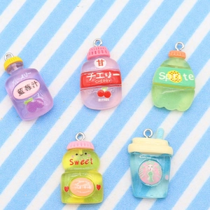 Detailed view of colorful resin miniature drink bottles and coffee cups with logos
