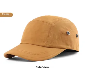 Side view of an orange five-panel camper cap with metal eyelets and reinforced stitching