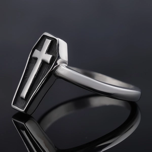 Macro shot of gothic coffin ring featuring a cross relief and vintage silver finish