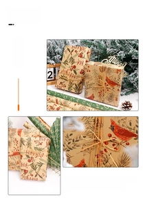 Detail of kraft Christmas wrapping paper featuring red birds, pine branches and hemp rope