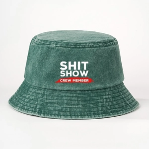 Washed green denim bucket hat featuring white Shit Show Crew Member printed text
