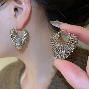 Iridescent heart beaded hoop earrings featuring faceted crystals in a vintage style