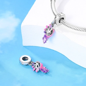 Detail showing the purple enamel feather charm with zircons on a silver bracelet