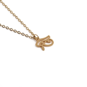 Gold stainless steel necklace featuring a polished Eye of Horus pendant on white background