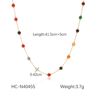 Detail view of gold stainless steel necklace with colored beads and size specifications