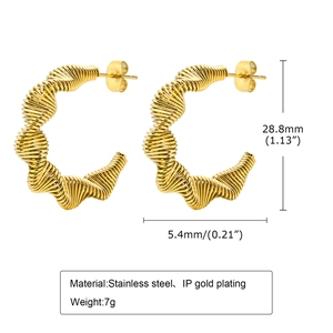 Detailed view of gold C-shaped twisted earrings showing 28.8mm diameter dimensions