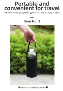 Close-up of glass water bottle with black insulated sleeve, strap and metal buckle