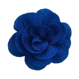 Macro shot of 7cm royal blue bubble crepe fabric camellia flower with layered textures
