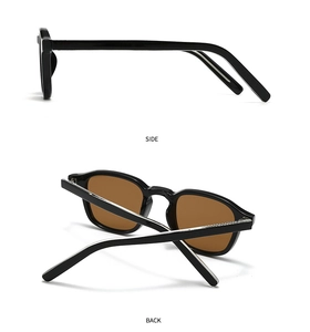 Detalle de gafas de sol vintage negras que muestra la estructura lateral y bisagras plateadas