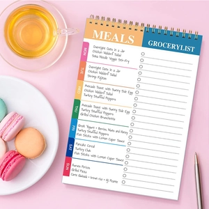 Minimalist weekly meal planner notepad with grocery list, spiral bound diary for daily scheduling.