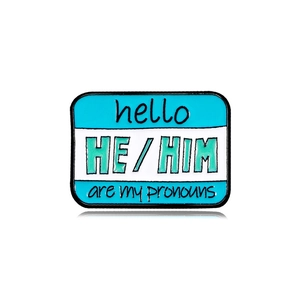 Teal and white rectangular enamel pronoun pin with HE/HIM pronouns lettering