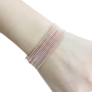 Rose gold multi-layer stackable carbon steel wire bracelet with spiral spring design