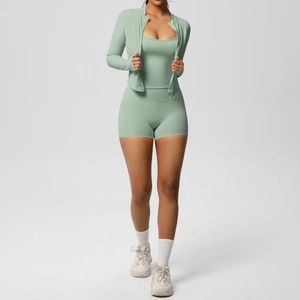Detailed close-up of sage green 3-piece yoga set with zip-up jacket and high waist shorts