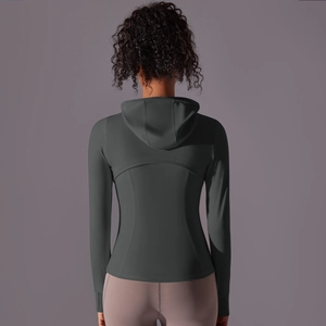 Rear view of a slim fit dark grey hooded sports jacket with zip pocket for yoga and running