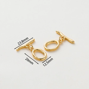 Macro shot of gold-plated copper OT toggles with 23.8mm, 20mm and 12.5mm size markings