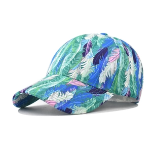 Detail of colorful feather print baseball cap with vibrant teal and pink patterns
