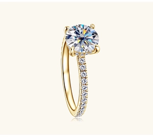 Macro side view of 2 carat Moissanite ring with four-prong setting and pavé gold band