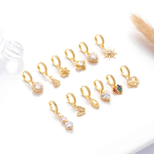 Detail of 12 gold-plated earrings with butterfly, flower, and heart zircon charms