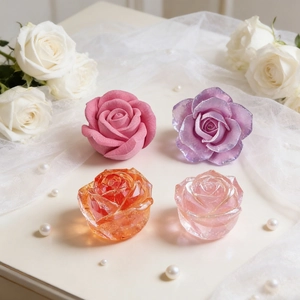 Romantic rose silicone molds showing finished pink, purple and orange floral candles