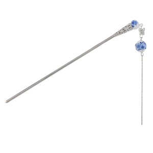 Blue and white porcelain hair pin with metal butterfly charm and long tassel on white background