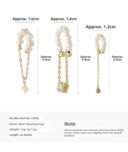 Detailed view of three freshwater pearl tassel ear clips with star and square pendants