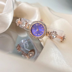 Elegant rose gold adjustable bracelet watch with purple dial and sparkling crystal bezel