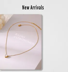Macro detail of heart zircon pendant on 18k gold plated stainless steel necklace chain