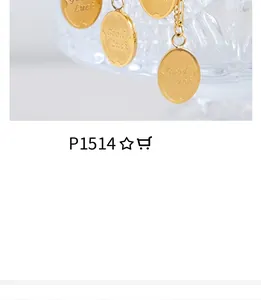 Detailed macro view of 18k gold plated round pendant with Good Luck engraving