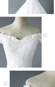 Exquisite close-up of white wedding dress with heavy lace embroidery and delicate pearls