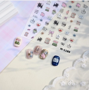 Detail of Korean M-1189 nail stickers featuring cartoon cats and floral relief patterns