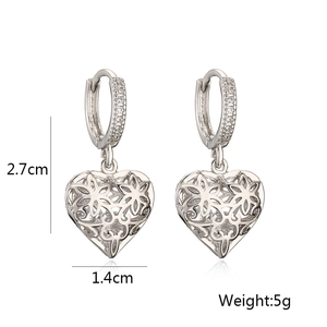 Detailed view of silver hollow heart earrings with dimensions 2.7cm and 5g weight