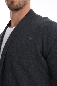 Close-up of men's dark grey knit cardigan with a ribbed collar and metal logo detail