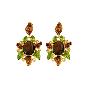 Vintage gold earrings with brown stone and green enamel leaf design in floral style