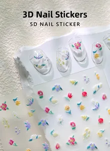 Detailed view of 5D relief nail stickers featuring 3D floral tulip and daisy patterns