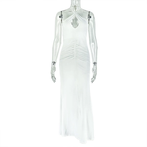 Detail of white halter neck maxi dress with teardrop cutout and elegant ruched waist
