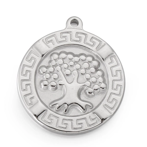 Macro shot of silver stainless steel Tree of Life pendant with Greek meander border