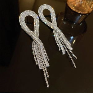 Elegant silver tassel earrings with shimmering crystals and a luxurious butterfly design
