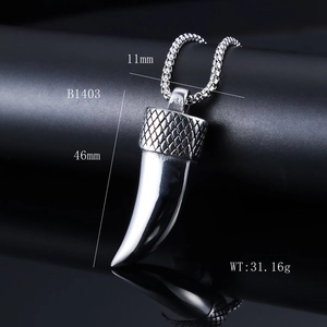 Macro shot of silver stainless steel wolf tooth pendant with dimensions and weight