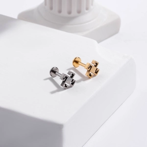 G23 titanium labret studs in gold and silver finish with geometric crown maze design