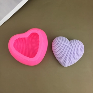 Pink heart-shaped woven silicone mold with a textured purple heart cake decoration